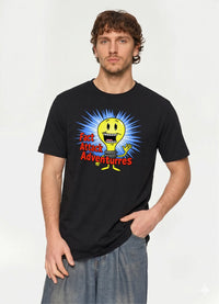Man wearing the black Fact Attack Adventures graphic tee