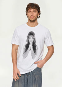 Man wearing the white Praying Hands photo graphic tee