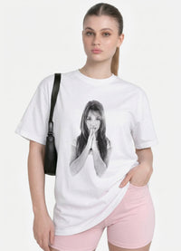 Woman wearing the white Praying Hands photo graphic tee